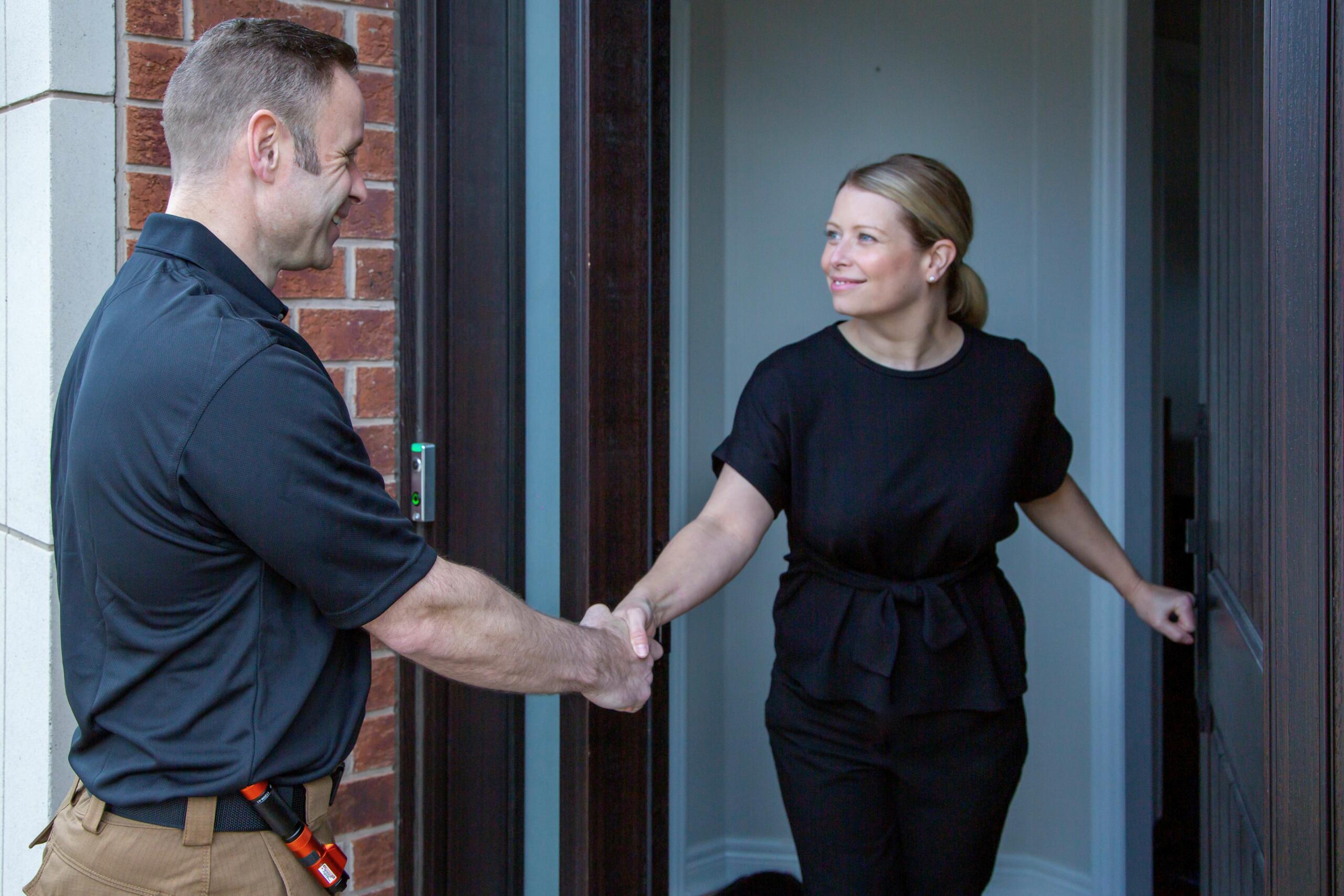 home inspector greeting a home owner.